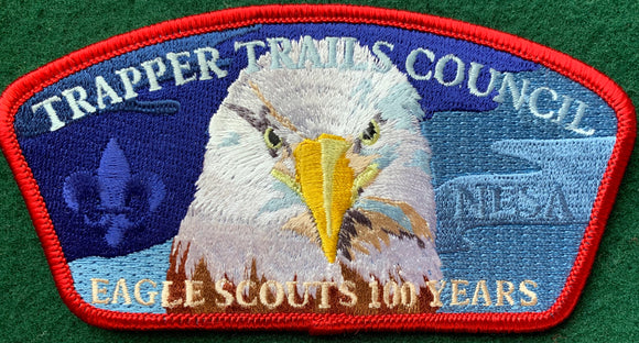 Trapper Trails Council Eagle Scouts '100 Years' Commerative Edition CSP SA-166:1. Ghosted 'NESA' and Bald Eagle Head Embroidered Detailing. Red Border. Mint Condition.