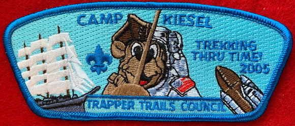 Trapper Trails Council 2005 Camp Kiesel Commerative Edition CSP SA-46. 'Trekking Thru Time!' Embroidered Detailing. Blue Border. Mint Condition.