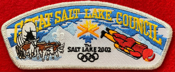 Great Salt Lake Council 2002 Salt Lake Winter Olympics Commerative Edition CSP SA-103. Embroidered Bull-Drawn Covered Wagon, Olympic Logo, and Skeleton Bobsled Details. Silver Mylar Border. Mint Condition.