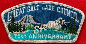 Great Salt Lake Council Camp Steiner 75th Anniversary Commerative CSP SA-138. White Camp Steiner Logo Detail. Silver Mylar Border. Part of 'L' Embroidery Missing in Council Name. Mint Condition.