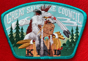 Great Salt Lake Council Friends of Scouting (FOS) Edition CSP SA-145. Embroidered Native American in Full Regalia within Forest with 'Kind' Detail. Teal Border. Mint Condition.