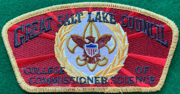 Great Salt Lake Council 'College of Commissioner Science' Edition CSP SA-147. Gold and Brown Scouting Fleur-de-lis within Gold Wreath Embroidered Details. Red/Dark Red Background. Gold Mylar Border. Mint Condition.