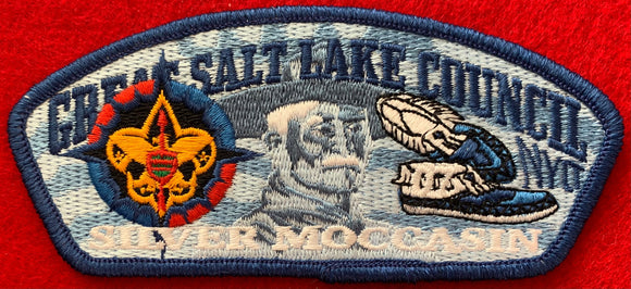 Great Salt Lake Council NYLT Silver Moccasin Commerative Edition CSP SA-169. Embroidered NYLT Compass Logo, Blue Moccasins, and Blue-scale Portrait of Lord Robert Baden-Powell Detailing. Blue Border. Mint Condition.