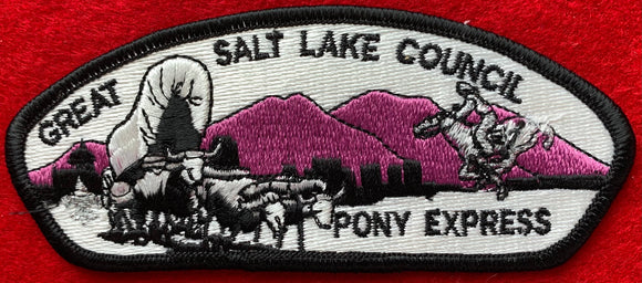 Great Salt Lake Council, Utah CSP SA-16. Embroidered Black and White Bull-Drawn Covered Wagon Infront of Light Purple Mountainscape and Silver Mylar Pony Express Details. Mint Condition.