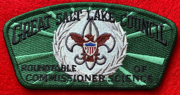 Great Salt Lake Council Roundtable of Commissioner Science Commerative CSP SA-214. Embroidered Brown and Silver Scout Fleur-de-lis in a Silver Wreath on a Green and Light Green Background. Dark Green Border. Mint Condition.