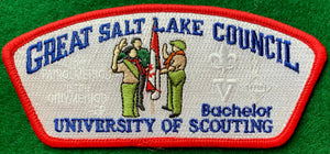 Great Salt Lake Council 'Bachelor' University of Scouting Commerative CSP SA-228. Embroidered Scouts infront of a Canadian Flag. "The Patrol Method is the Only Method - BP" Text Ghosted into White Background. Red Border. Mint Condition.