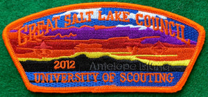 Great Salt Lake Council 2012 University of Scouting Commerative CSP SA-231. Embroidered "Antelope Island" Landscape. Scouting Fleur-de-lis and Venturing Logo Ghosted into Multicolored Background. Orange Border. Mint Condition.