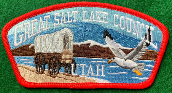 Great Salt Lake Council CSP SA-274. Embroidered Covered Wagon and Flying Seagull infront of Mountain Lake Landscape. Red Border. Mint Condition.