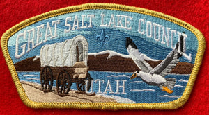 Great Salt Lake Council CSP SA-277. Embroidered Covered Wagon and Flying Seagull infront of Mountain Lake Landscape. Gold Mylar Border. Mint Condition.