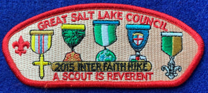 Great Salt Lake Council 2015 Interfaith Hike Commerative CSP SA-279. Various Embroidered Religious Medal Details. 'A Scout is Reverant' Text. Red Border. Mint Condition.