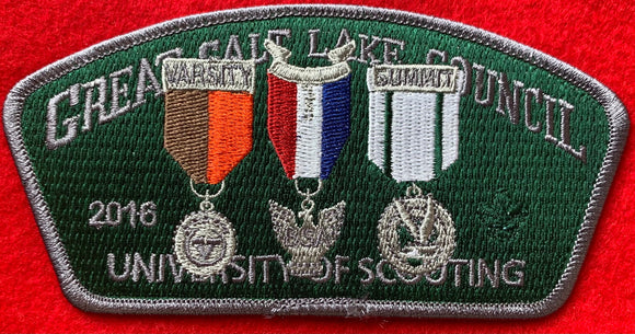 Great Salt Lake Council 2016 University of Scouting Commerative CSP SA-289. Embroidered Varsity Scouting Denali Award Medal, Eagle Scout Medal, and Venturing Summit Award Medal on Green Background. Dark Gray Border. Mint Condition.