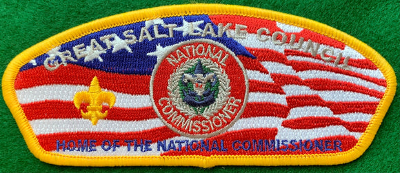 Great Salt Lake Council CSP SA-304. Embroidered National Commissioner Patch with 'Home of the National Commissioner' Text over American Flag Background. Yellow Border. Mint Condition.