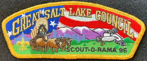 Great Salt Lake Council 1996 Scout-O-Rama Commerative Edition CSP SA-39. Embroidered Bull-Drawn Covered Wagon Infront of Light Purple Snow-Covered Mountainscape with American Flag Background Details. Gold Mylar Border. Mint Condition.