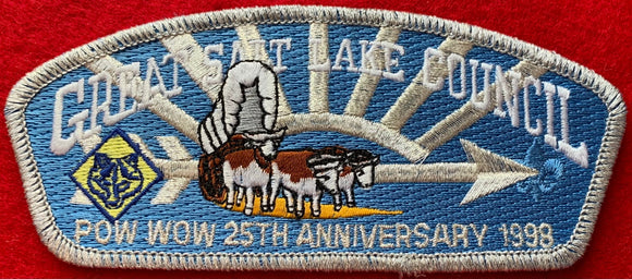 Great Salt Lake Council 1998 25th Anniversary of Pow Wow Commerative Edition CSP SA-57. Embroidered Bull-Drawn Covered Wagon Infront of Silver Mylar Arrow of Light Iconography. Silver Mylar Border. Mint Condition.