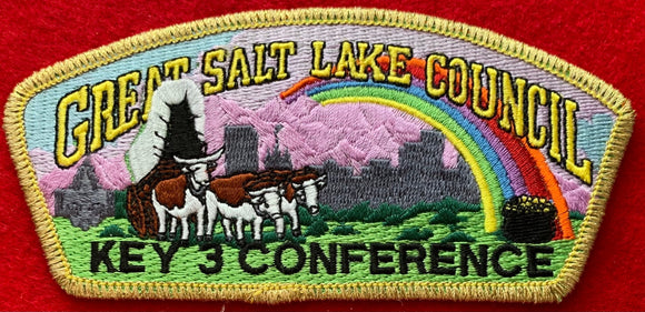 Great Salt Lake Council Key 3 Conference Commerative CSP SA-60. Embroidered Bull-Drawn Covered Wagon Infront of Rainbow with Pot of Gold. Gold Mylar Border. Mint Condition.