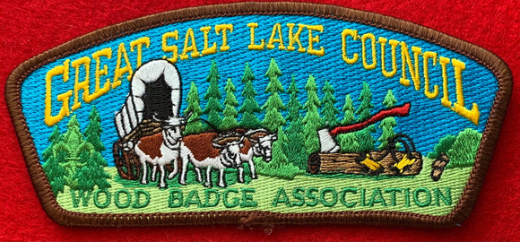 Great Salt Lake Council Wood Badge Association Commerative CSP SA-65. Embroidered Bull-Drawn Covered Wagon Infront of Wooded Background Details. Brown Border. Mint Condition.