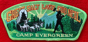 Great Salt Lake Council Camp Evergreen Commerative CSP SA-70. Green Forested Background with Lumberjack Silhouette Embroidered Details. Mint Condition.