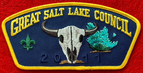 Great Salt Lake Council CSP TA-216. Embroidered Bull Skull with a Teal and Green Plant on a Dark Blue Background. '2011' Ghosted into the Dark Blue Background. Yellow Border. Mint Condition.