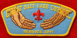 Great Salt Lake Council 2011 Service Commerative CSP TA-220. Embroidered Open Palms with a Red Fleur-de-lis on a Light Blue Background. Yellow Border. Mint Condition.