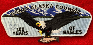 Great Alaska Council | 100 Years of Eagles Commerative CSP SA-23. Embroidered Eagle "Catching" Fish (on Rivet). Mint Condition.