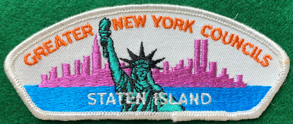 Greater New York Councils - Staten Island CSP T-1. Embroidered Statue of Liberty over New York City Skyline with Twin Towers Detailing. White Border. Mint Condition.