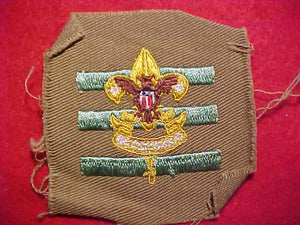 JUNIOR ASSISTANT SCOUTMASTER, FULL SQUARE ON TAN TWILL, 1936-42, TALL CROWN, MINT