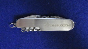 Buck Toms Camp Knife Stainless, China, 7 implements mint, in box.