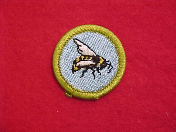 BEEKEEPING, MERIT BADGE WITH CLEAR PLASTIC BACK, GREEN BORDER, NO IMPRINTS/LOGOS IN PLASTIC