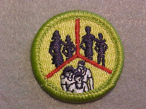 FAMILY LIFE- SKINNY PEOPLE, MERIT BADGE WITH CLEAR PLASTIC BACK, GREEN BORDER, NO IMPRINTS/LOGOS IN PLASTIC