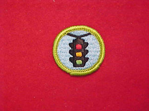 AUTOMOTIVE SAFETY, MERIT BADGE WITH CLOTH BACK, GREEN BORDER, 1969-72
