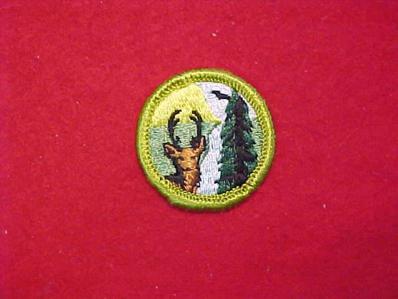 CONSERVATION OF NATURAL RESOURCES, MERIT BADGE WITH CLOTH BACK, GREEN BORDER, 1965-69