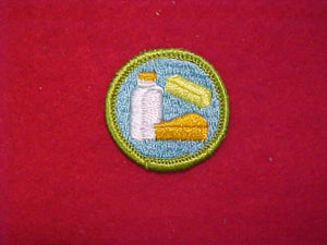 DAIRYING, MERIT BADGE WITH CLOTH BACK, GREEN BORDER, 1969-72