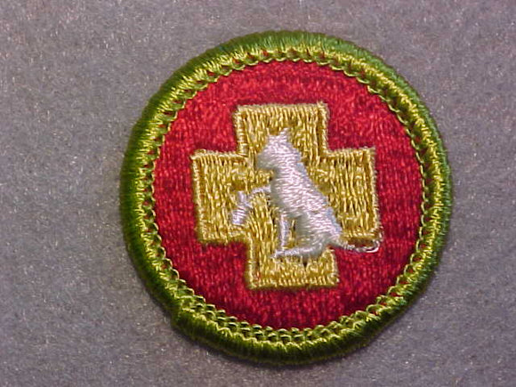 FIRST AID TO ANIMALS, MERIT BADGE WITH CLEAR PLASTIC BACK, GREEN BORDER, NO IMPRINTS/LOGOS IN PLASTIC