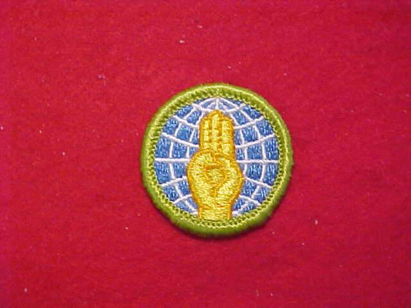 WORLD BROTHERHOOD (SCOUT SIGN), MERIT BADGE WITH CLOTH BACK, GREEN BORDER, 1969-72