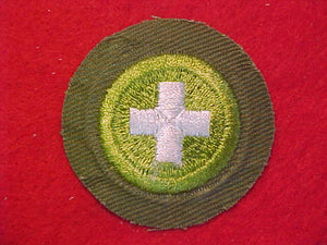 SAFETY, MERIT BADGE WITH CRIMPED EDGE, KHAKI, ISSUED 1946-60