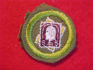 STAMP COLLECTING, MERIT BADGE WITH CRIMPED EDGE, KHAKI, ISSUED 1946-60
