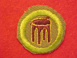 WOODWORK, MERIT BADGE WITH CRIMPED EDGE, KHAKI, ISSUED 1946-60