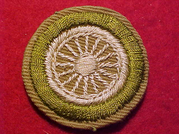 CYCLING MERIT BADGE, CRIMPED EDGE, TAN, ISSUED 1936-45