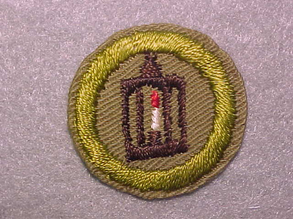 METALWORK, MERIT BADGE WITH CRIMPED EDGE, TAN, ISSUED 1936-45