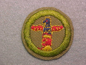WOODCARVING, MERIT BADGE WITH CRIMPED EDGE, TAN, ISSUED 1936-45