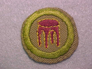 WOODWORK, MERIT BADGE WITH CRIMPED EDGE, TAN, ISSUED 1936-45