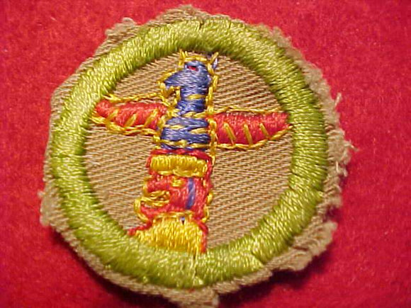 WOOD CARVING FINE TWILL MERIT BADGE, WWII VARIETY, CUT TO ROUND