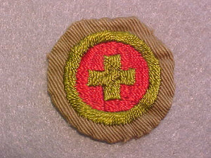 FIRST AID MERIT BADGE, WIDE BORDER CRIMPED, ISSUED 1932-36, USED