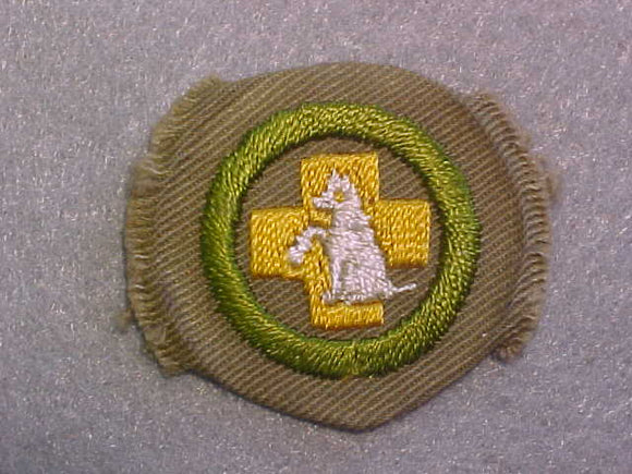 FIRST AID TO ANIMALS MERIT BADGE, WIDE BORDER CRIMPED, ISSUED 1932-36, MINT