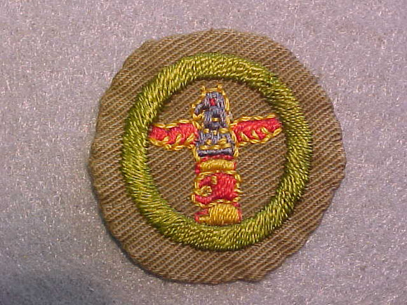 WOOD CARVING MERIT BADGE, WIDE BORDER CRIMPED, ISSUED 1932-36, USED