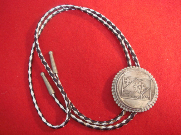 77 NJ bolo, black and silver braided string, token with round mount