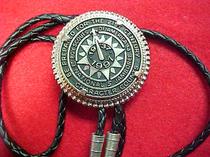 1997 bolo, token style, braided black leather string