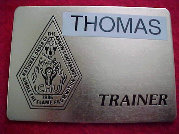 1986 NOAC NAME BADGE, TRAINER, METAL, USED (THOMAS)