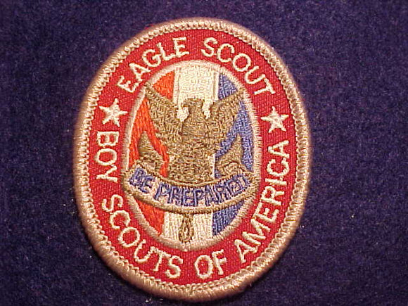 EAGLE RANK, TYPE 12D, WHITE BORDERS ON WHITE STRIPE BETWEEN RED AND BLUE, NARROW OVAL KNOT BELOW SCROLL, SCOUT STUFF IMPRINT OVER GAUZE PLASTIC BACK, 2002-